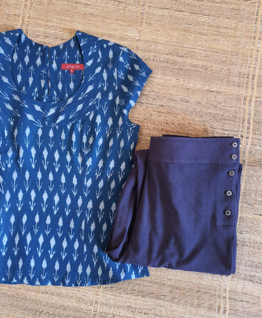 Image of a top in ink blue ikkat paired with deep purple pants