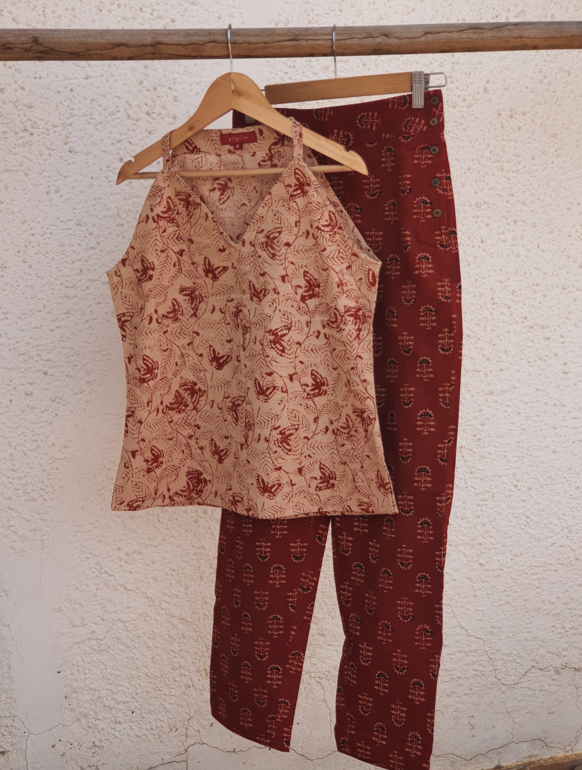 Picture pf a halter top in block print with red ajrakh pants