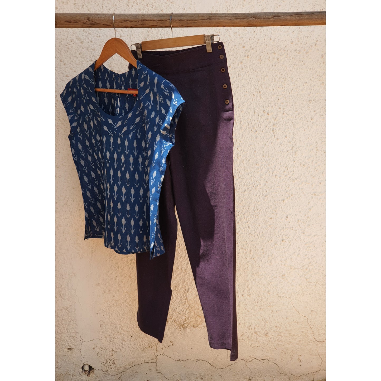 image of ink blue ikkat top paired with purple pants
