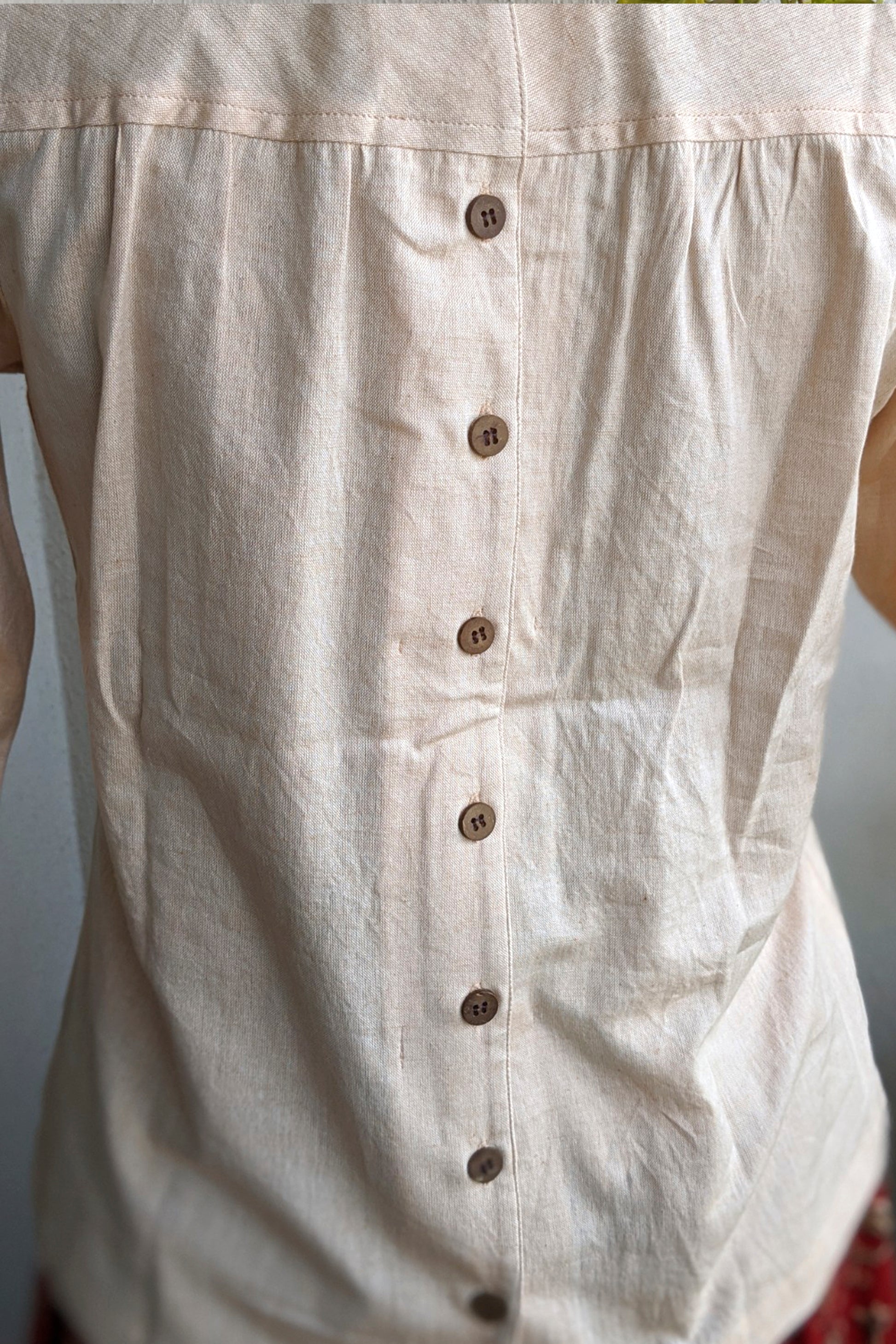 Back view of the top. image of the button placket at the back